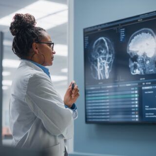 doctor reviewing TBI brain injury scan